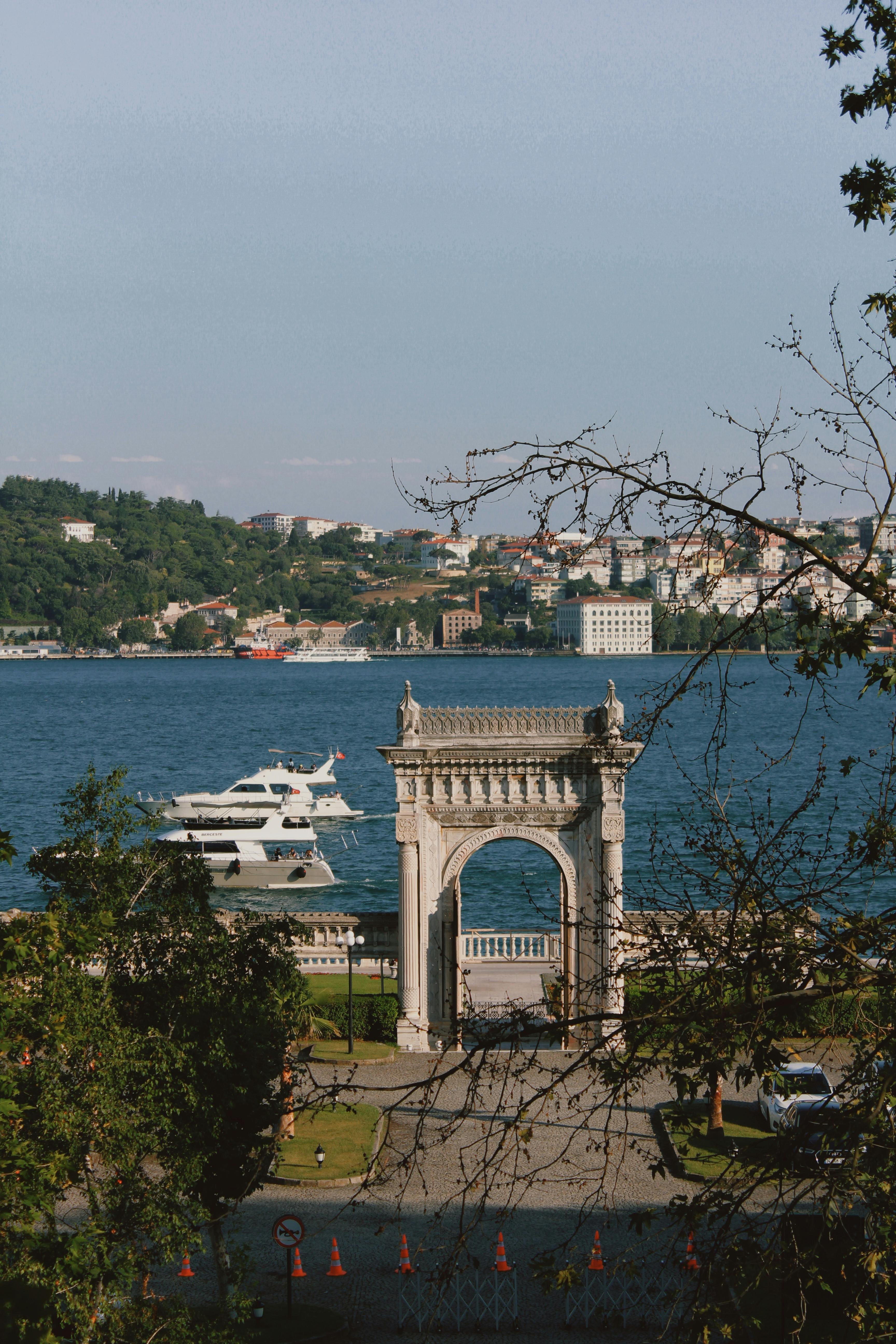 White Concrete Arch Near Body of Water · Free Stock Photo