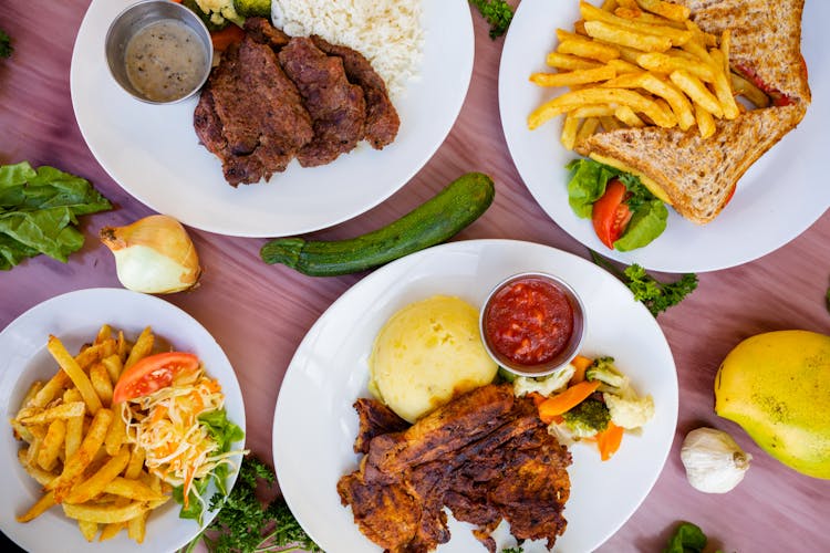 Photo Of Plates With Meals On A Table