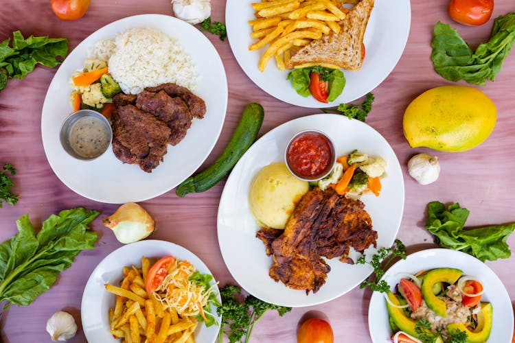 Dishes On Plates On Table In Restaurant