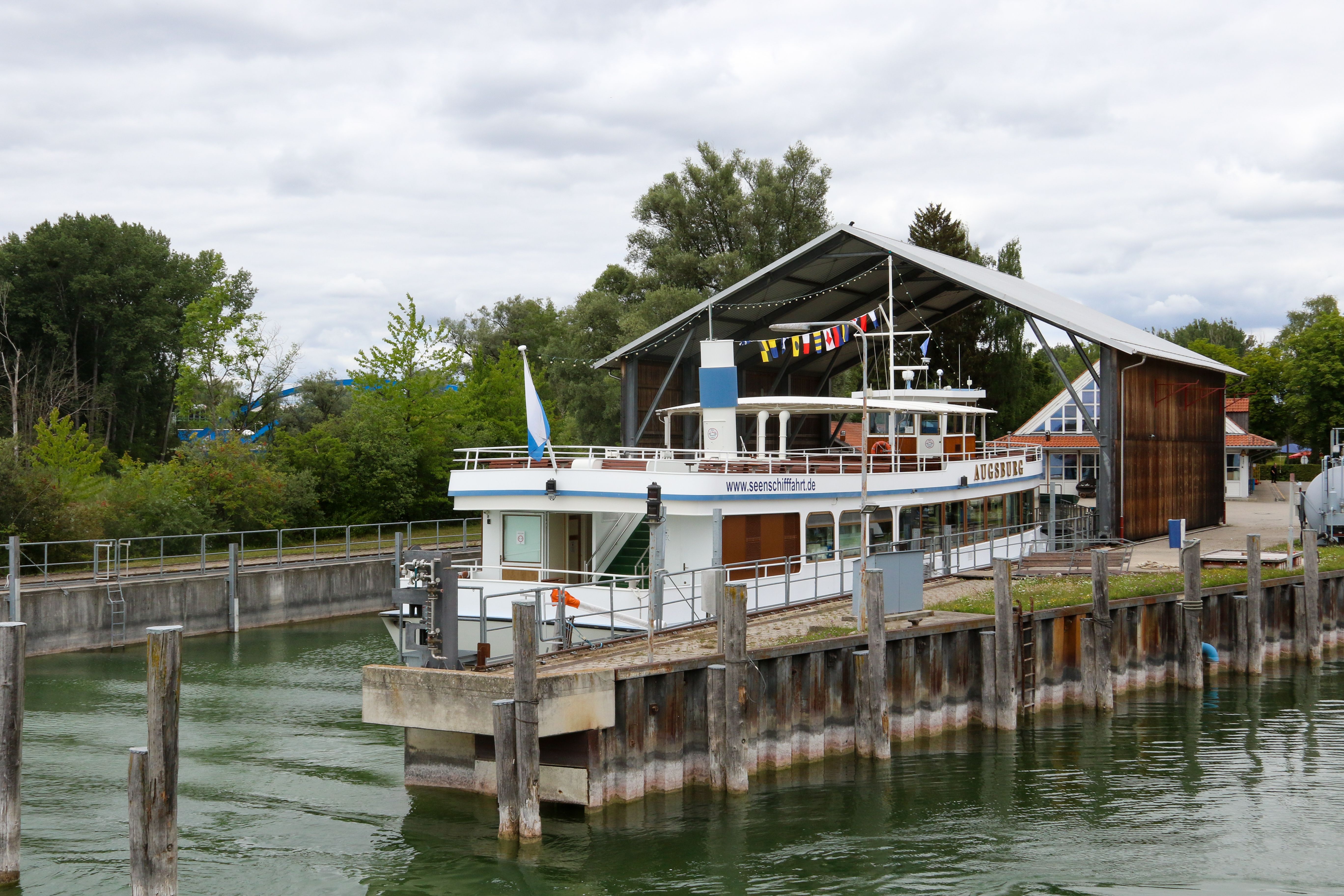 A scenic view of a passenger ship docked at Inning am Ammersee harbor, Bavaria, Germany.