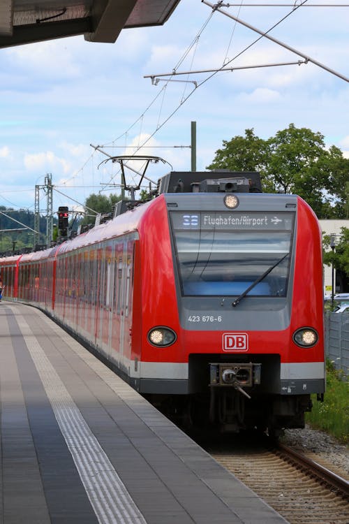 Red and Gray Train on Rail Tracks