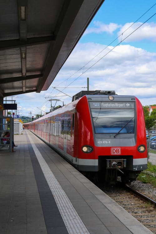 Red and Gray Train on Rail Tracks