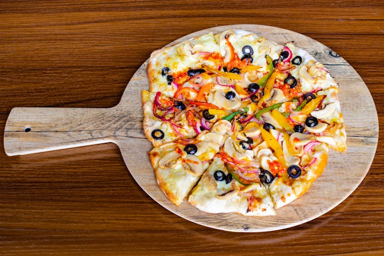 Fresh Pizza On A Wooden Tray