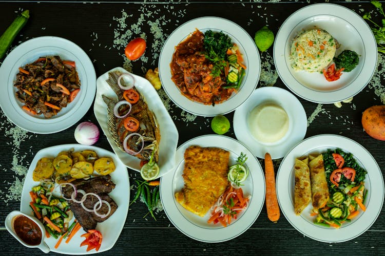  Plates With Main Courses On A Table