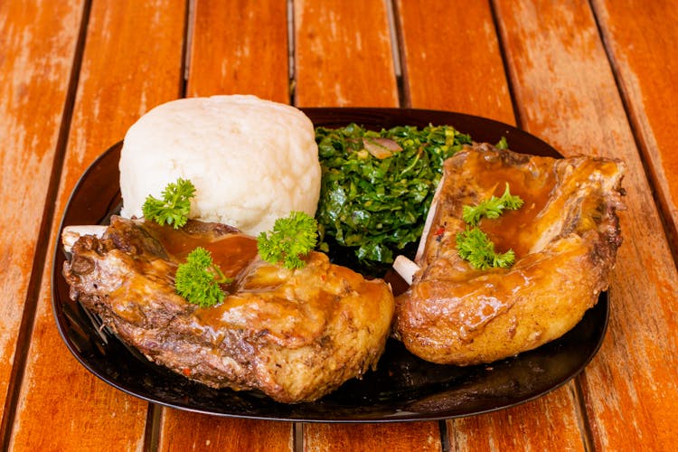 Cooked Food On A Black Plate