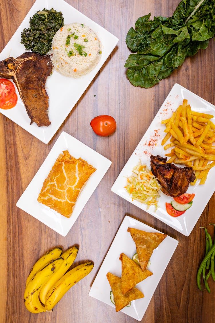 Dishes On Plates On Wooden Table