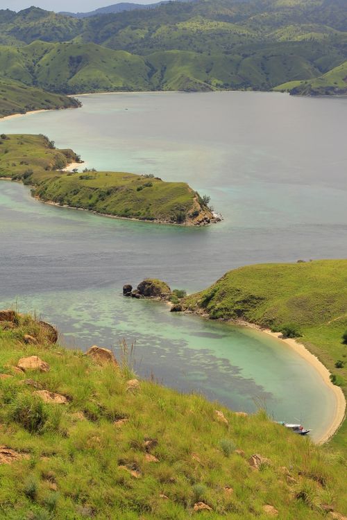 Free Explore the lush landscapes and serene waters of Komodo Island, East Nusa Tenggara. Stock Photo