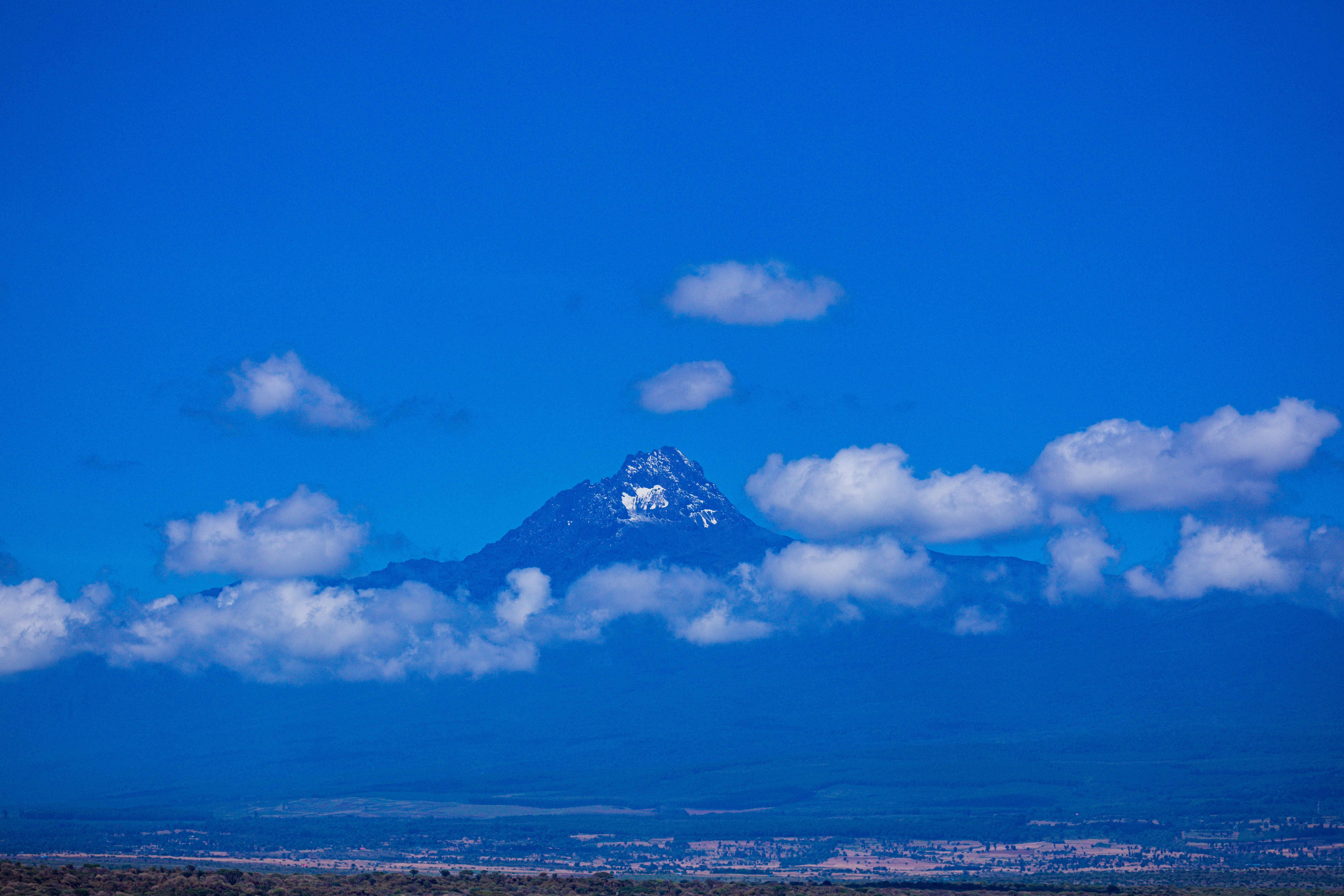 Fluffy White Clouds over Mountains in Snow · Free Stock Photo
