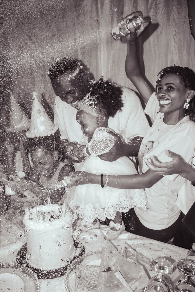 Happy Family At A Birthday Party In Grayscale