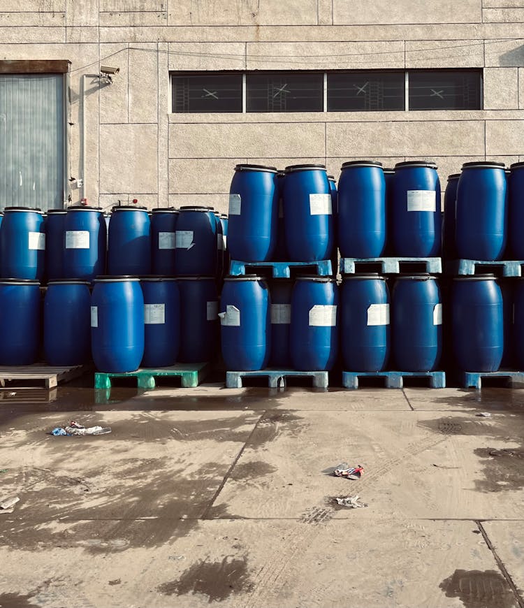 Blue Plastic Barrels On Pallets