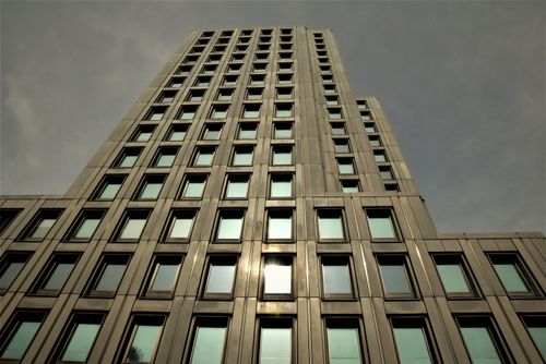 Free Low-angle shot of a contemporary skyscraper with reflective windows. Stock Photo
