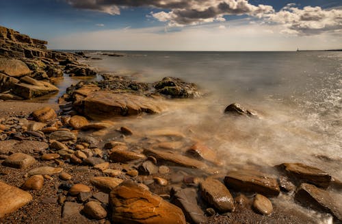 Ilmainen kuvapankkikuva tunnisteilla hiekkaranta, kivet, kivinen rannikko