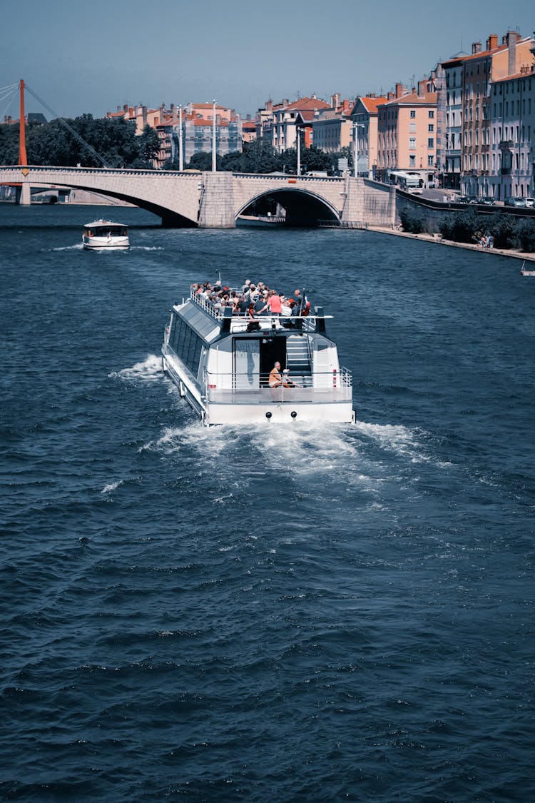 People Riding On A Boat On A River Cruise