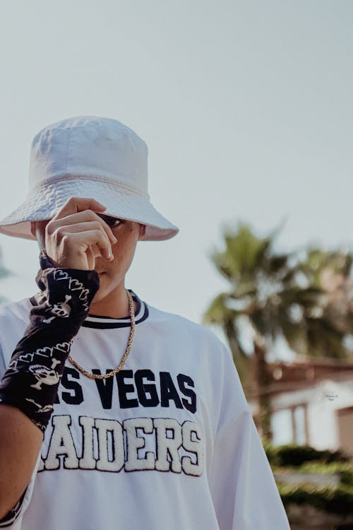 Man in White Shirt and a Bucket Hat