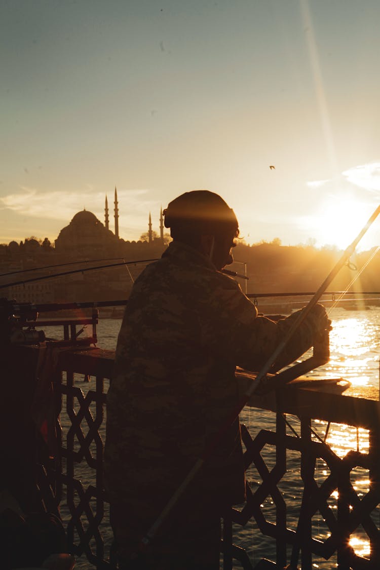 Person Fishing At The Galata Bridge