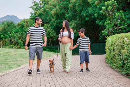 Free Family Walking with a Dog Stock Photo