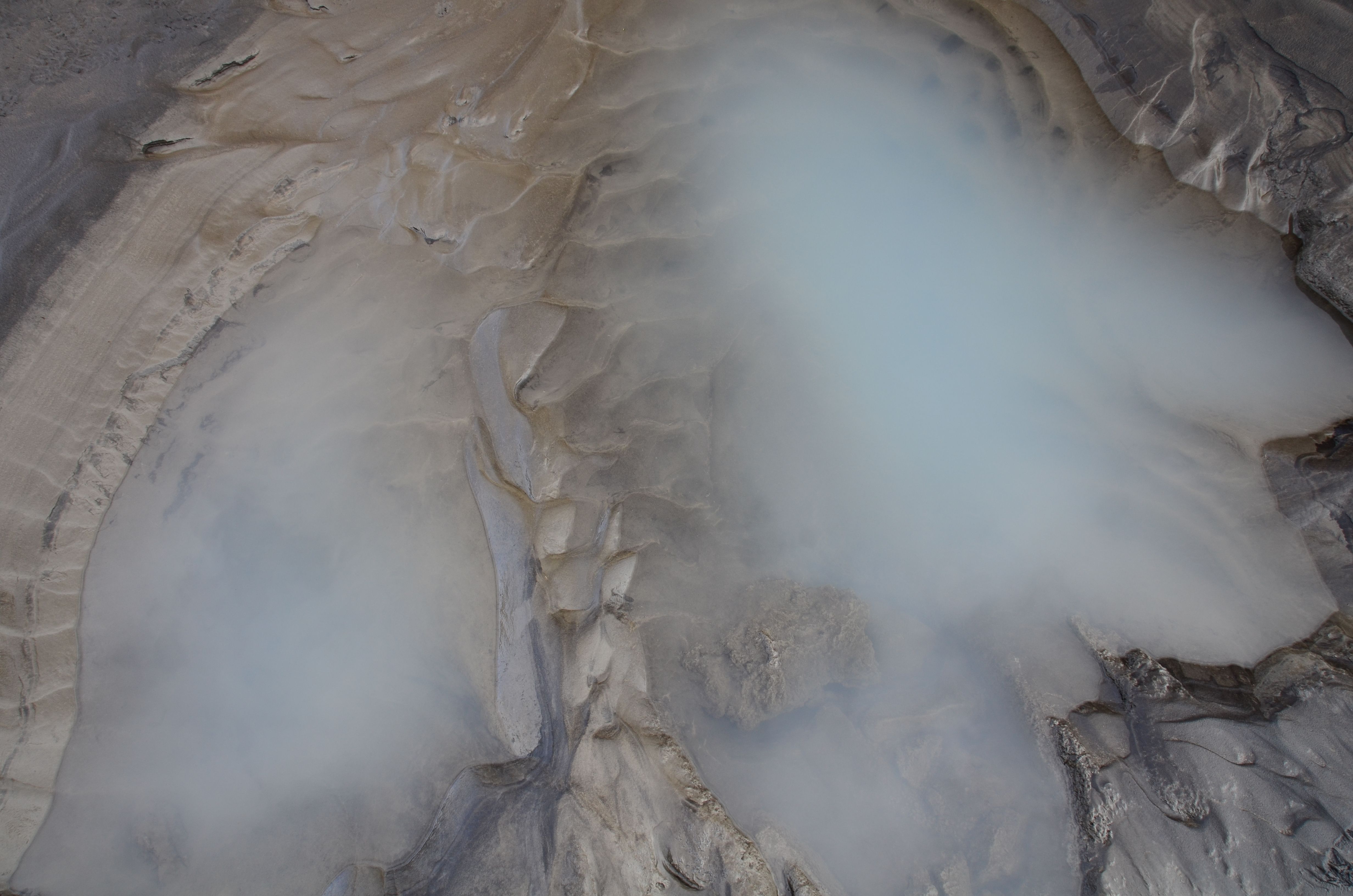 Best Fire and Ice Helicopter Tour: Glacier and Hengill Geothermal Area Review Review 2026 - Explore Iceland's stunning geothermal terrain from above, with mist hovering over the rugged landscape.