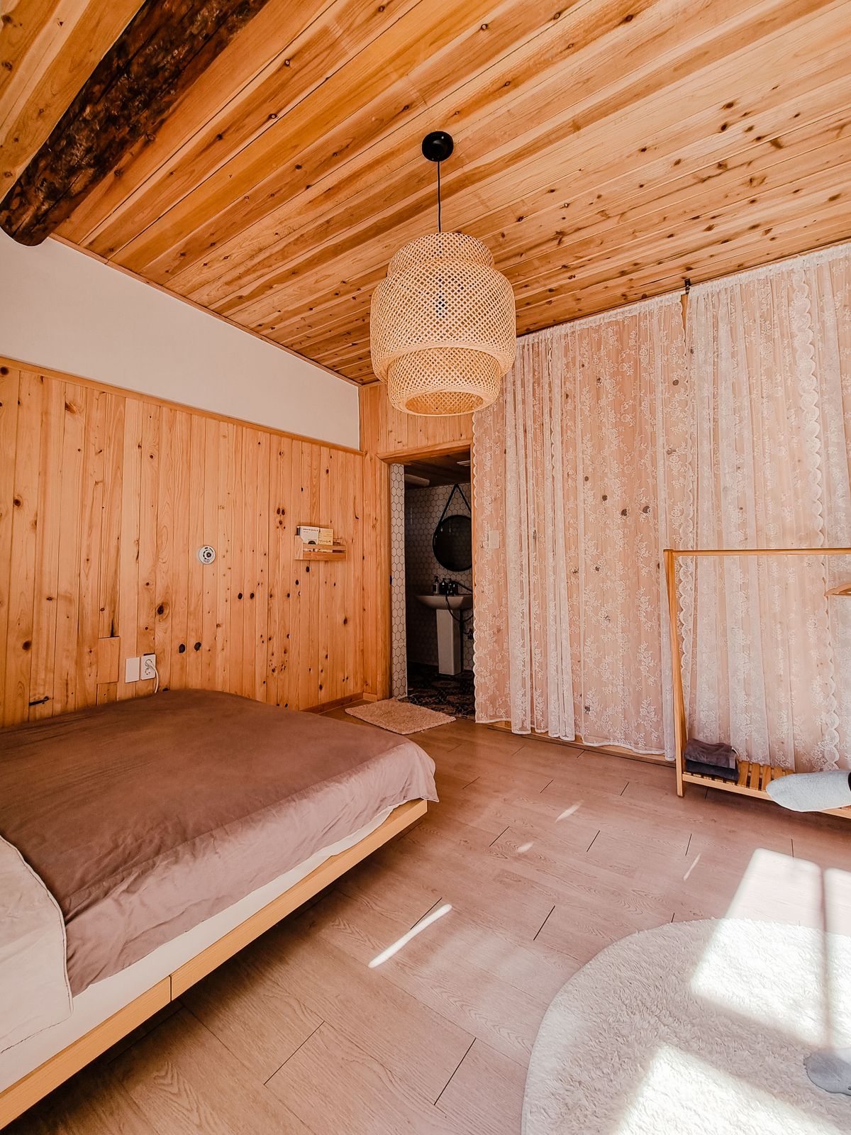 Warm wooden interior room with natural ambient lighting, timber walls, and minimalist furniture — Chinese modern lighting aesthetic