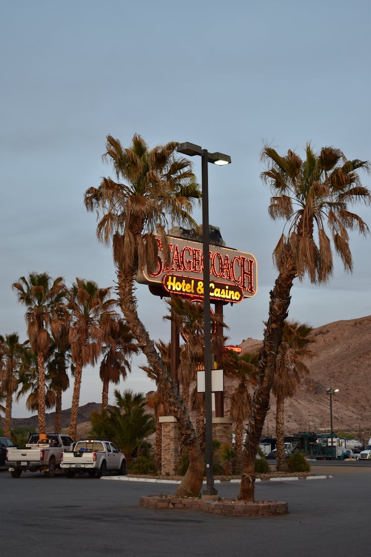 Neon Sign Of Stagecoach Hotel And Casino Near Parking Lot