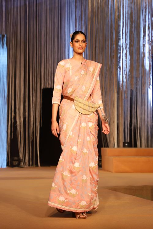 Free Model in floral saree walks down runway in Faridabad fashion show, showcasing elegance and style. Stock Photo