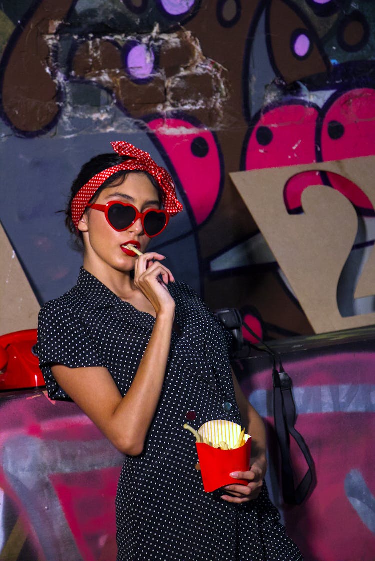 A Woman Eating French Fries