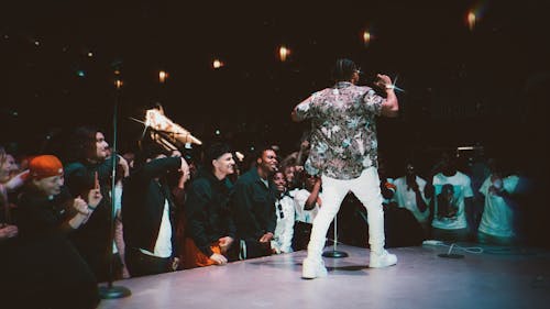 Back View of a Man Performing on Stage