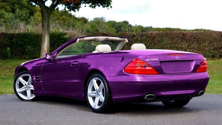 Close-Up Shot Of A Violet Convertible Car