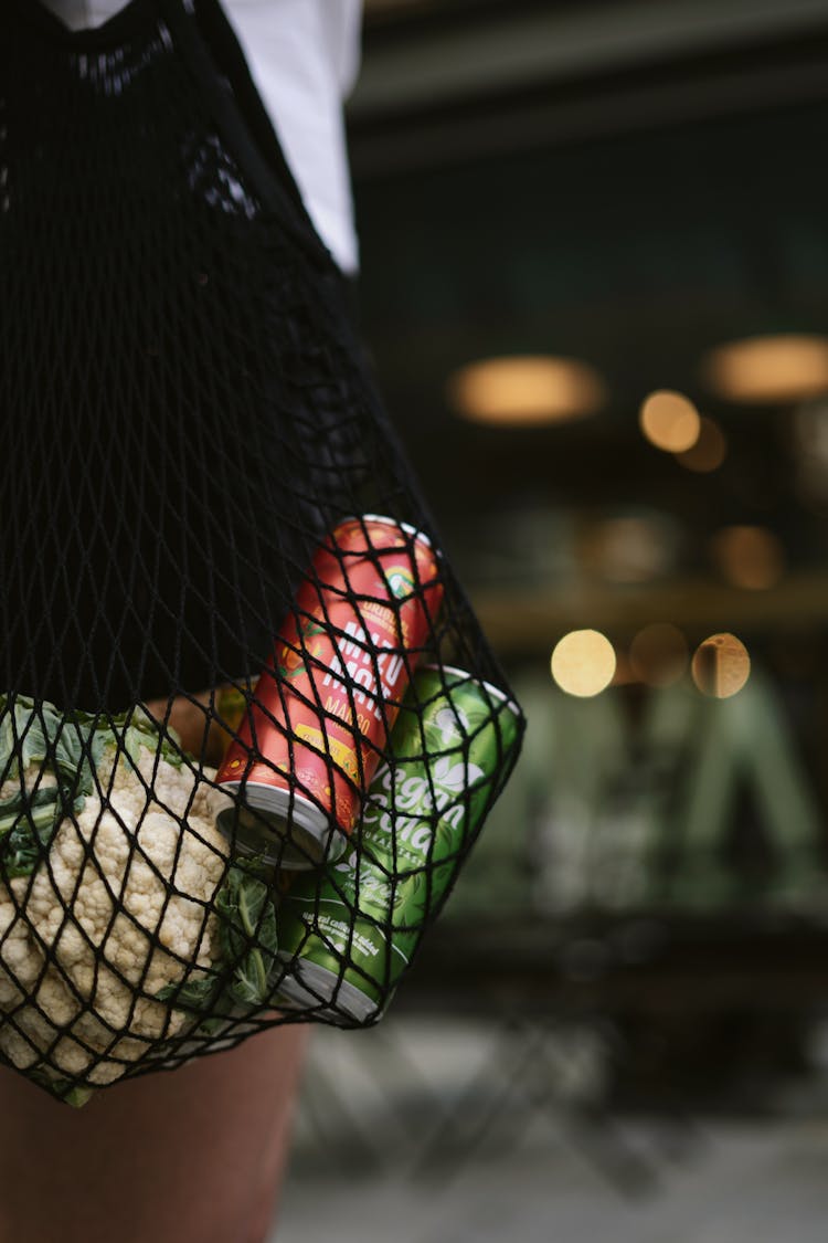 Canned Carbonated Drinks In A Net Bag