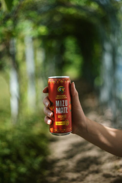 A Person Holding a Vitamizu Mizu Mate Yerba Soda