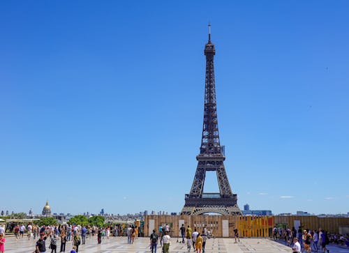 People Walking on Street Near Eiffel Tower