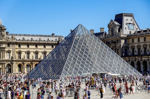 People Walking Beside the Louvre Pyramid