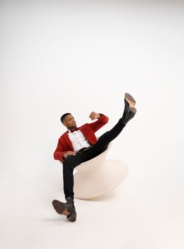 Man Sitting on Unstable Chair