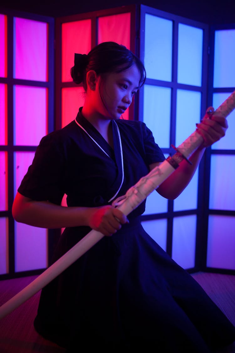 Woman In Black Robe Holding White Katana