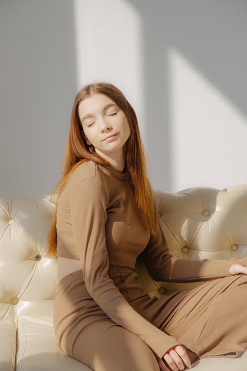 Woman Sitting with Eyes Closed