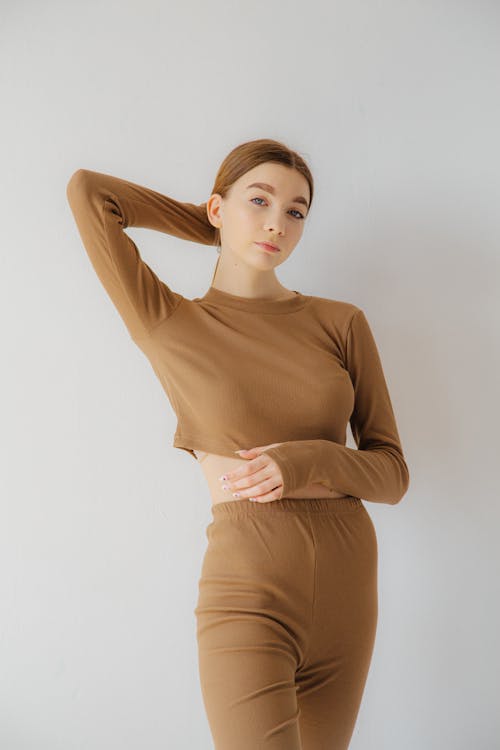 Woman with Hand behind Head on White Background