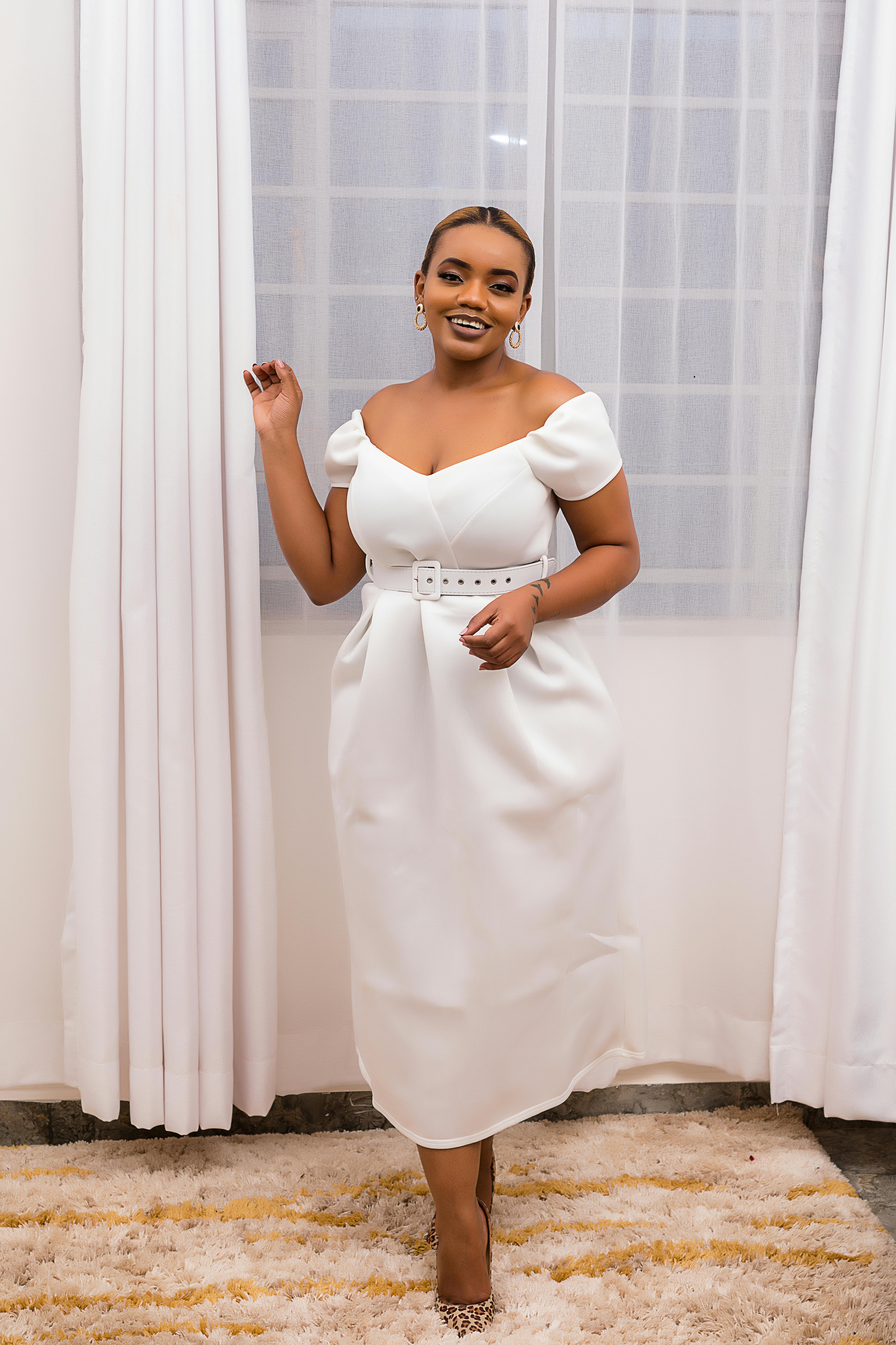 smiling woman wearing short wedding dress