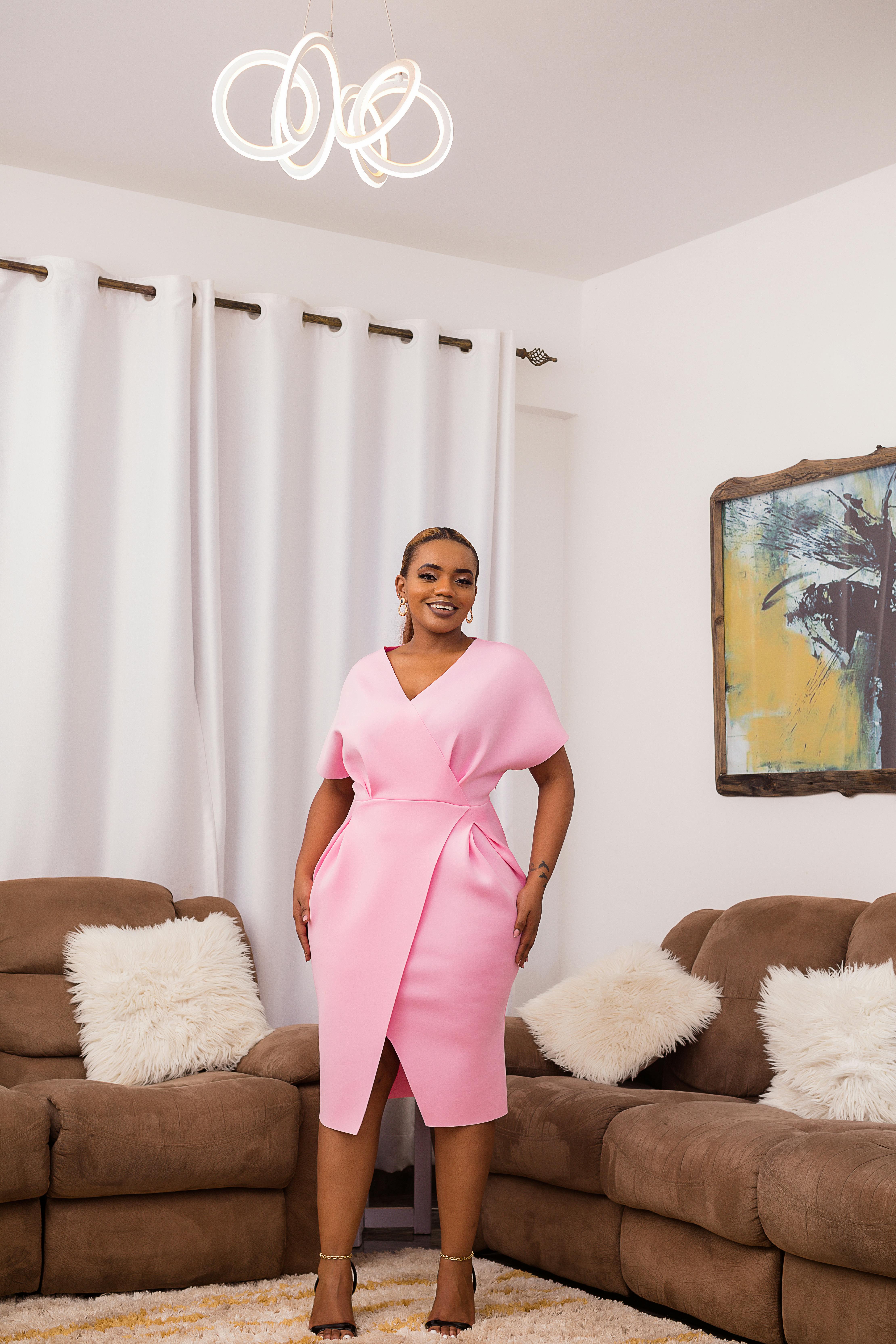 smiling woman in pink dress