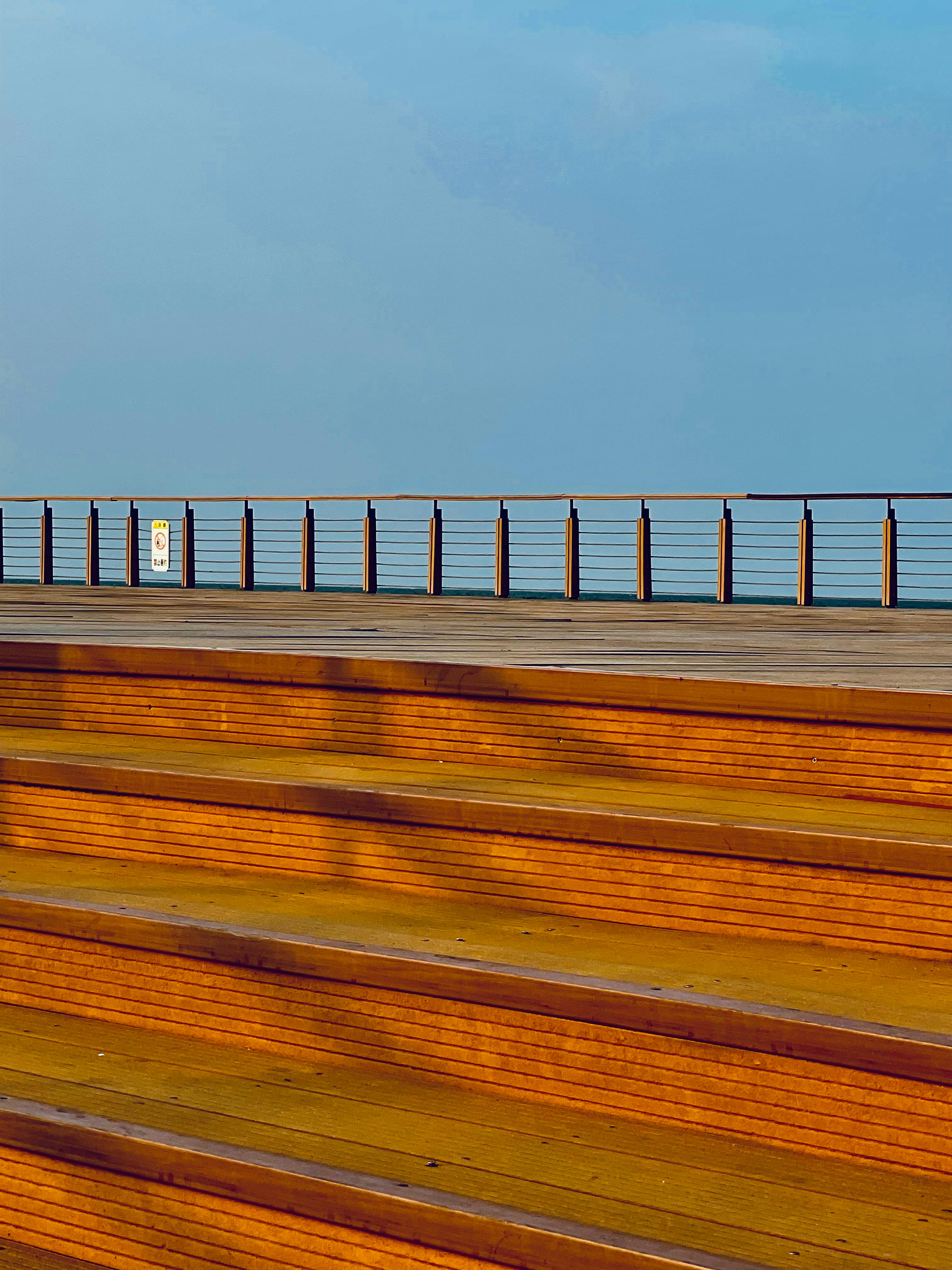 Wooden Bleachers against Blue Sky · Free Stock Photo
