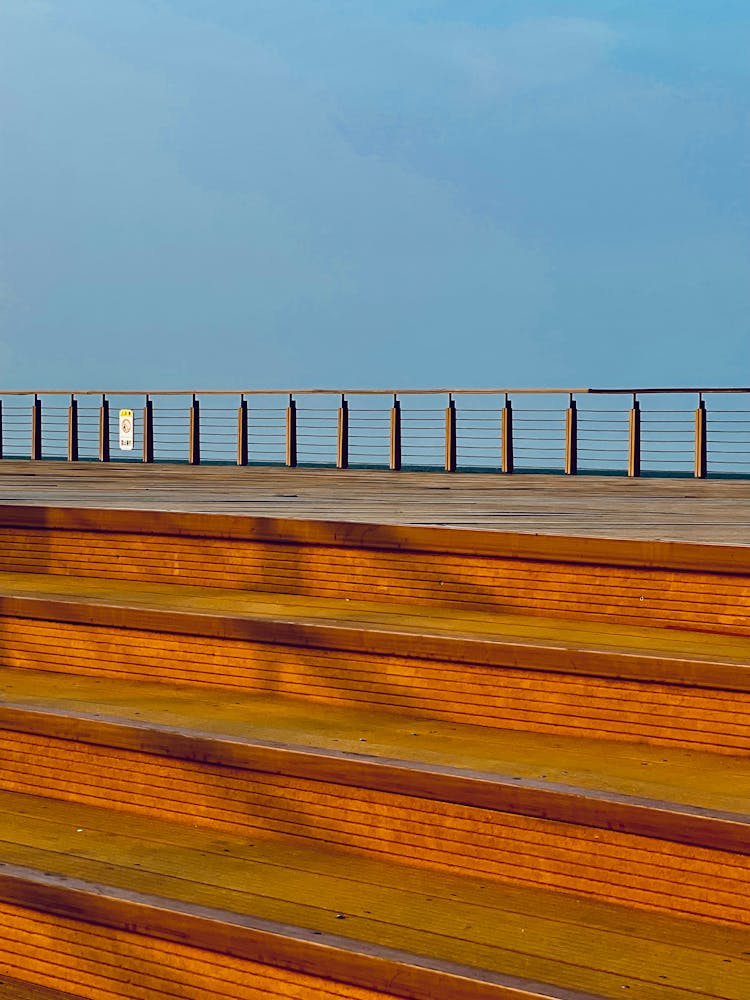 Wooden Bleachers Against Blue Sky