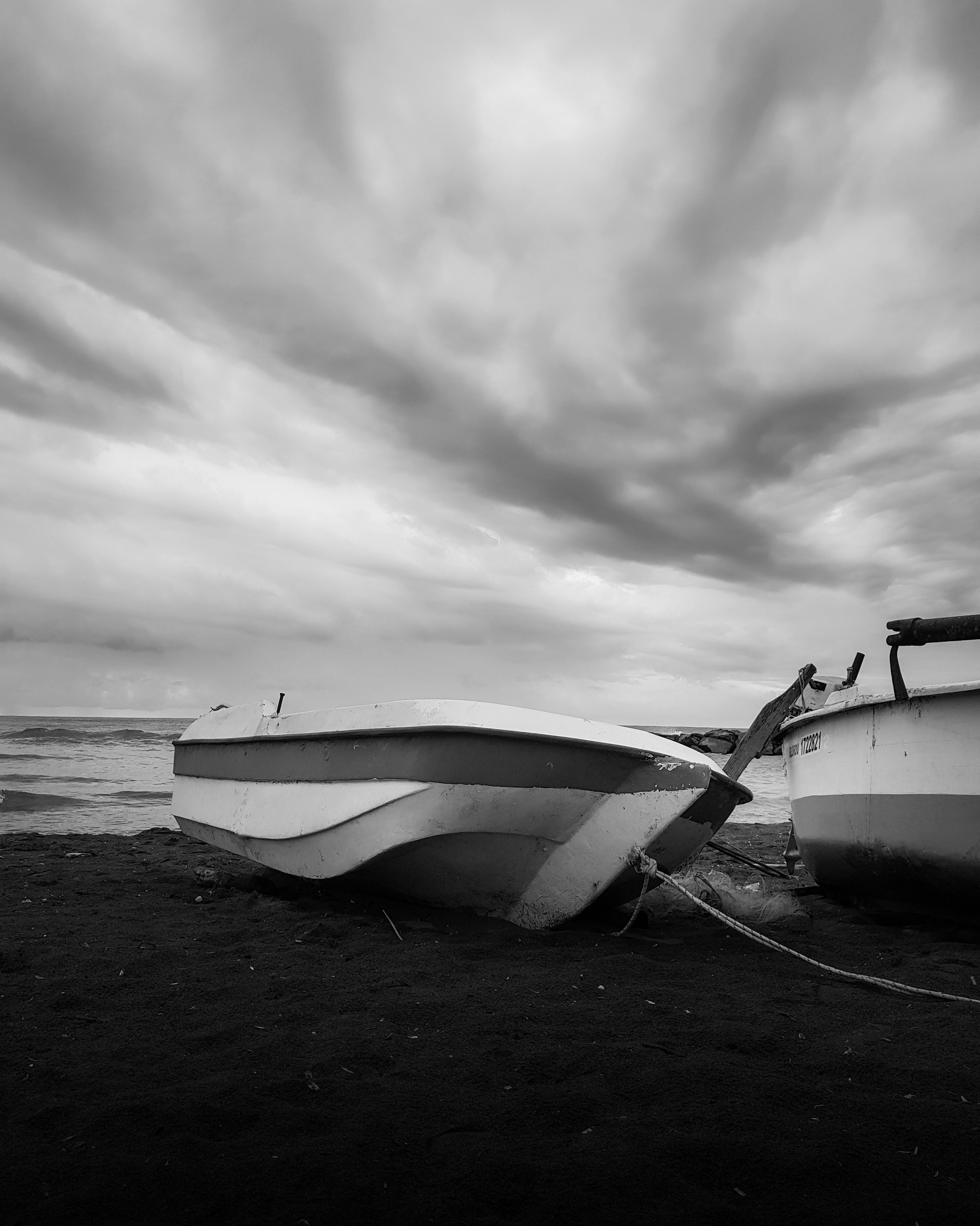 Fishing Boat on Beach in Black and White · Free Stock Photo