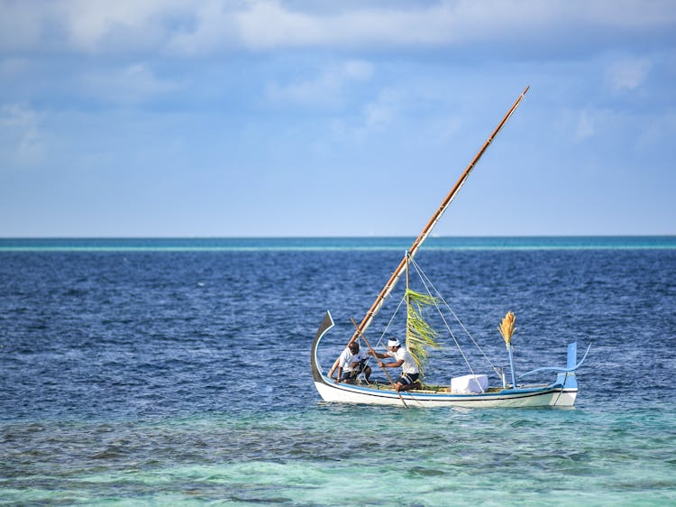 Men Sailing On A Boat 