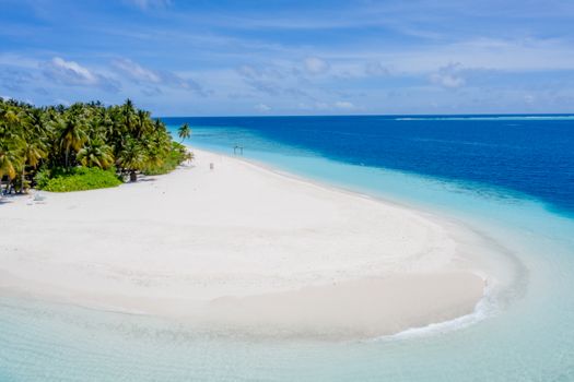 Beautiful white sandy beach with turquoise waters in Guraidhoo, Maldives, showcasing serene tropical paradise.