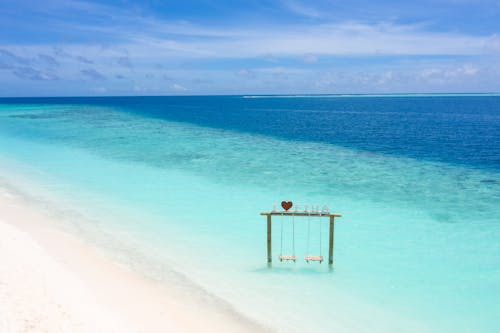 Fotos de stock gratuitas de agua, arena, cielo azul