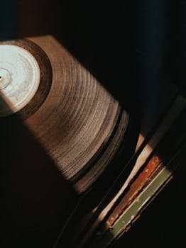 Vintage vinyl record captured with warm artistic lighting in Rio Vermelho, Brazil.