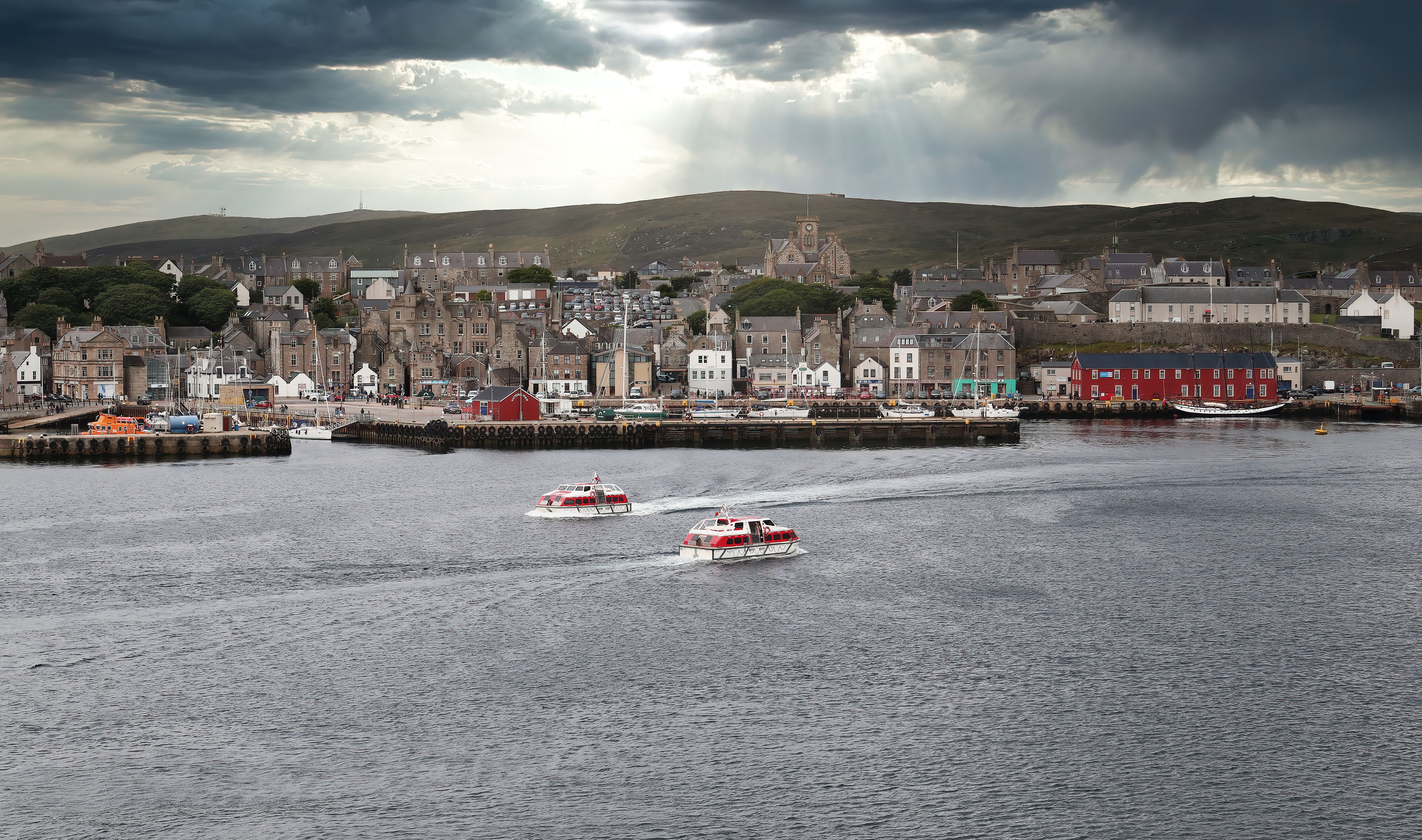 Lerwick waterfront from the harbour, stone buildings along the shore