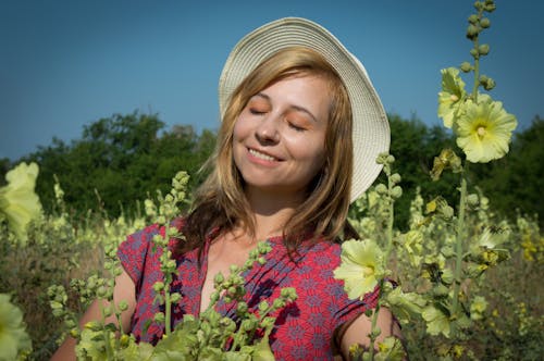 Woman Standing on Flower Field