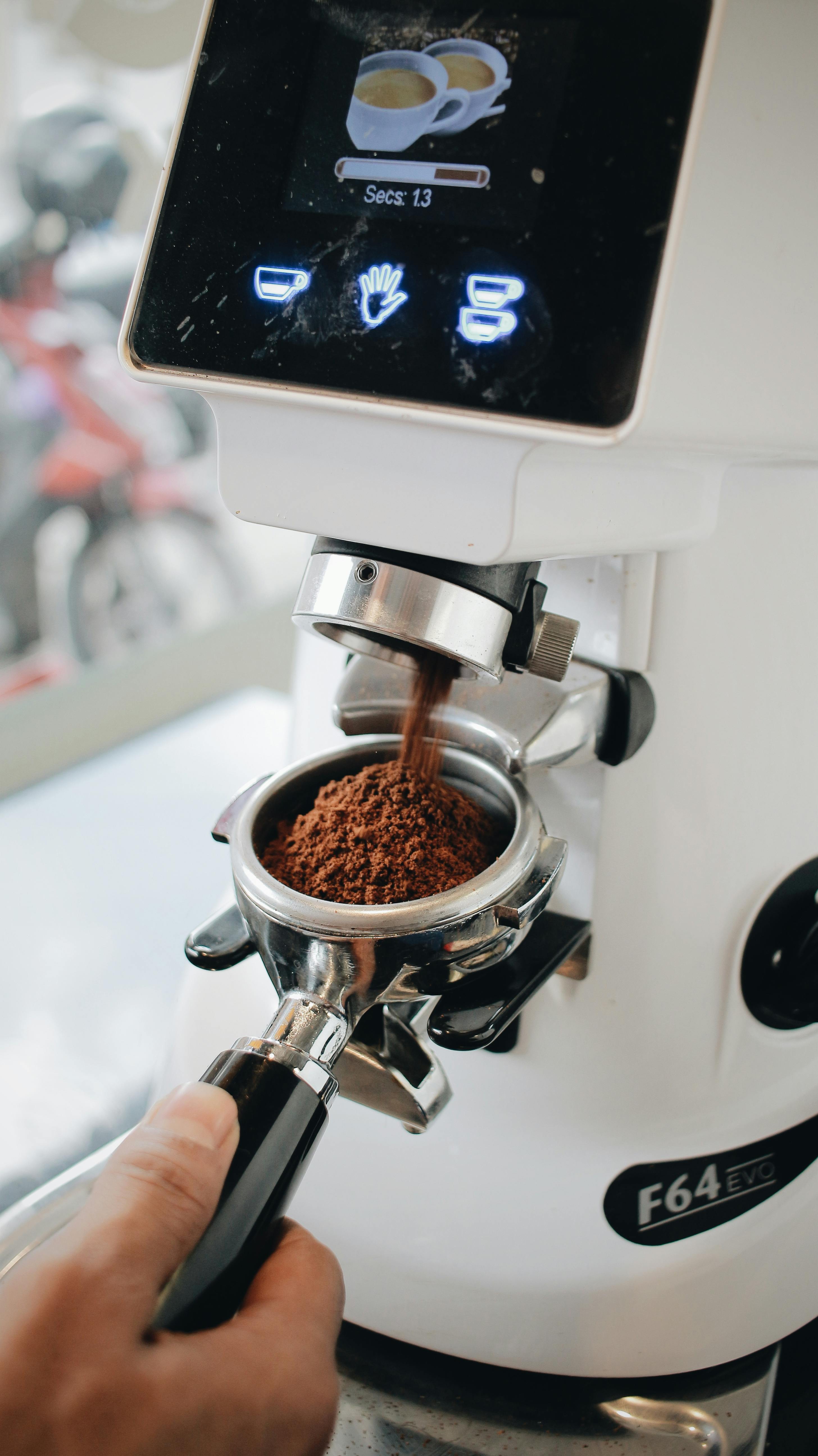 A Person using Coffee Grinder · Free Stock Photo
