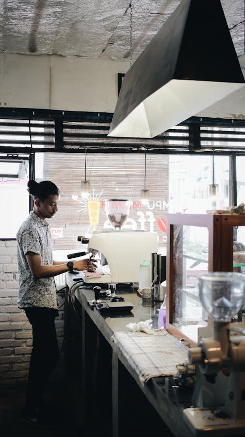 Man Making Coffee on a Machine
