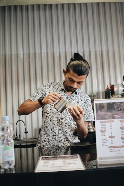 Photo of a Man Making Coffee