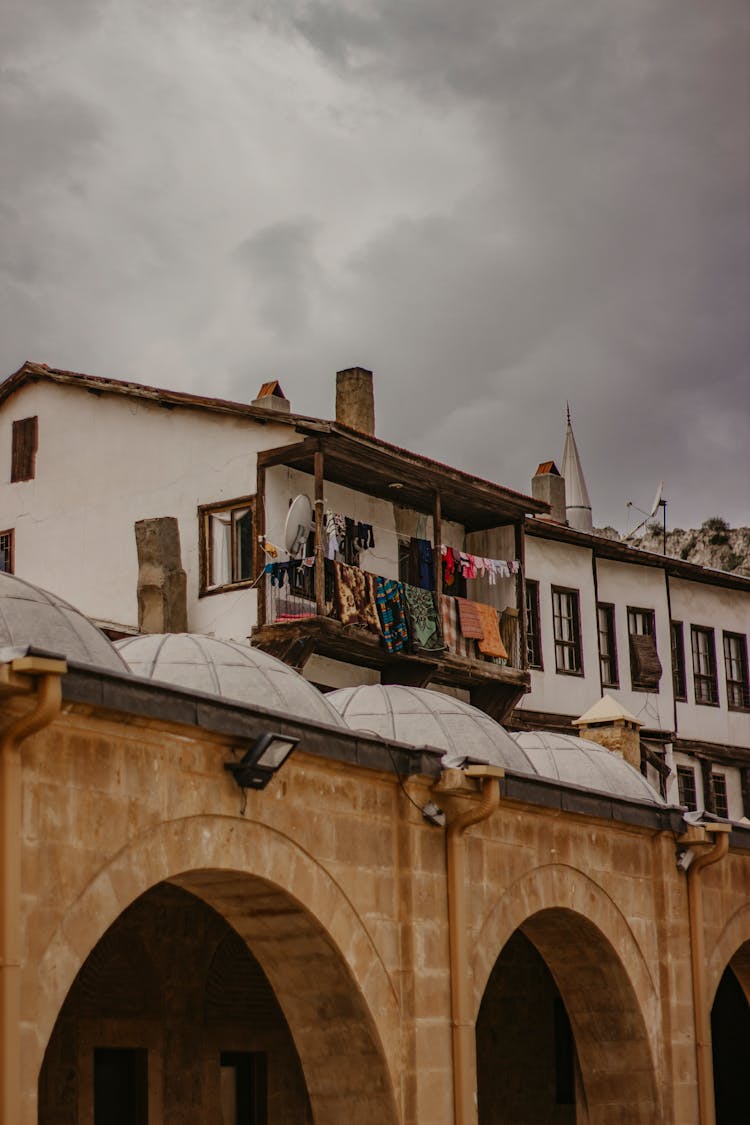 Clothes Hanging On The Wooden Balcony 